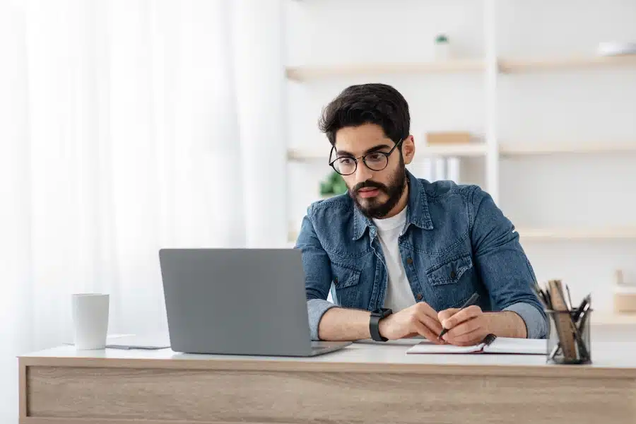 Man on laptop studying a public policy course