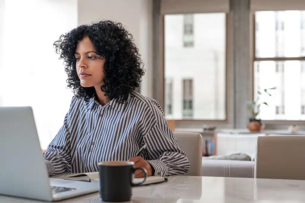 woman studying online public policy short course at home